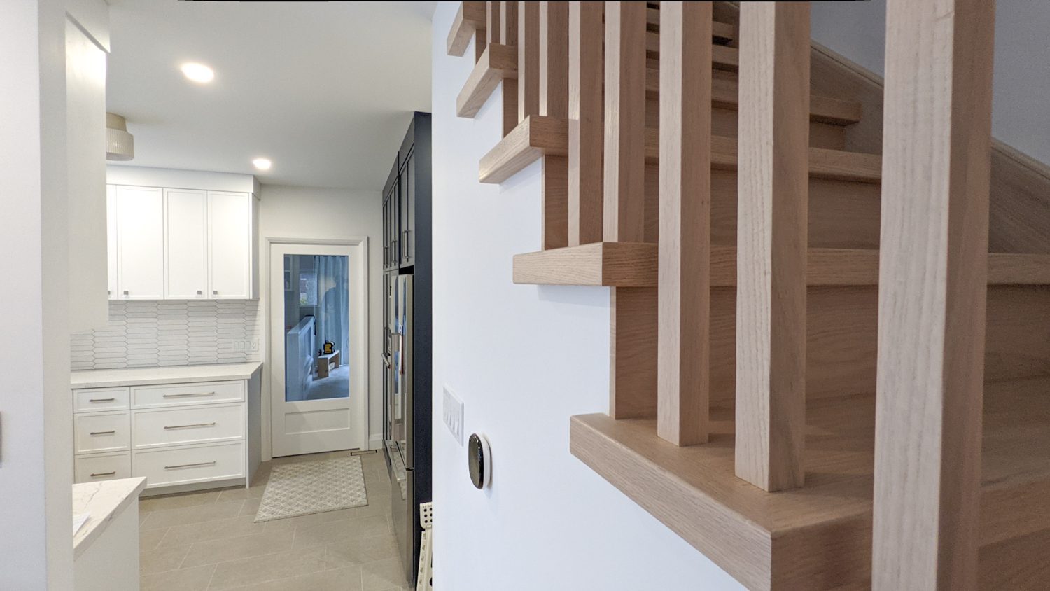 Toronto home renovation, wood stairs, railings and new kitchen