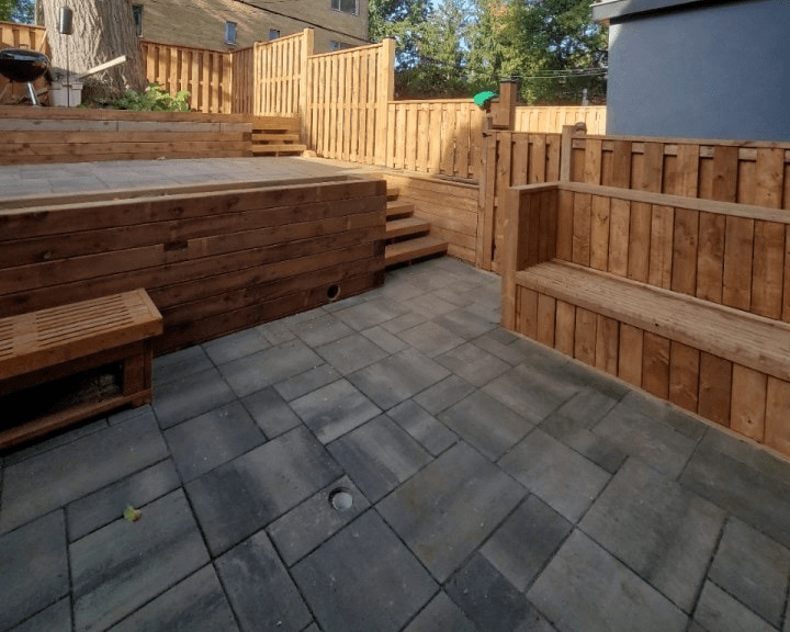 Toronto backyard hardscaping stone patio renovation and fence