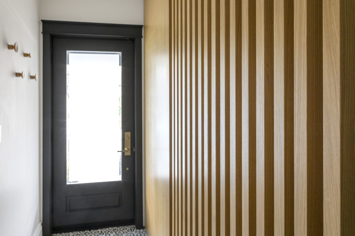 Corso Italia, Toronto First-floor home renovation, front door, wood divider